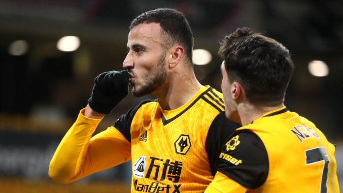 Romain Saiss of Wolverhampton Wanderers celebrates with teammate Pedro Neto after scoring their team's first goal during the Premier League match between Wolverhampton Wanderers and Tottenham Hotspur Image credit: Getty Images