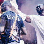 Davido's fallen bodyguard TJ wipes sweat off the musician during performance