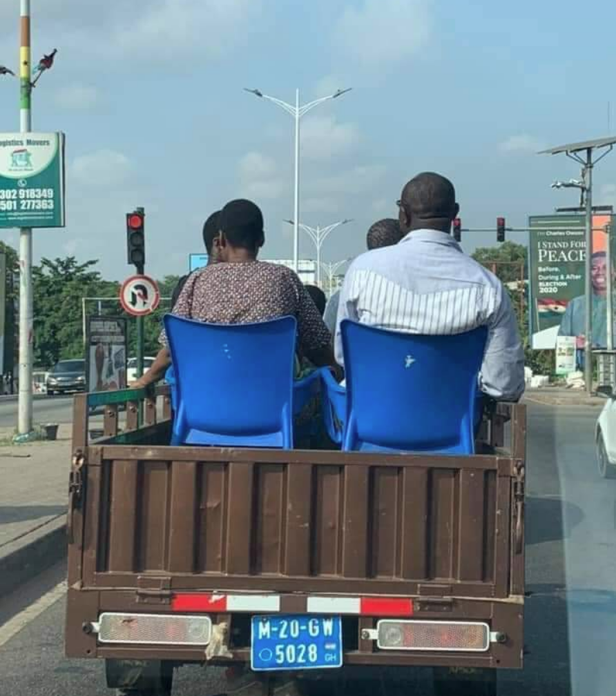 Friends take a ride sitting on plastic chairs on a 3-wheeler cargo tricycle | Adomonline.com