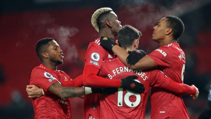 Manchester United's Portuguese midfielder Bruno Fernandes (C) celebrates with teammates after scoring their second goal from the penalty spot during the English Premier League football match between Manchester United and Aston Villa at Old Trafford in Man Image credit: Getty Images