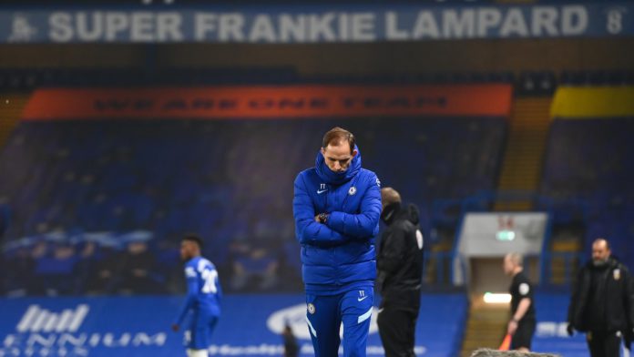 Thomas Tuchel the head coach / manager of Chelsea looks on with a banner for former head coach / manager Frank Lampard above him during the Premier League match between Chelsea and Wolverhampton Wanderers at Stamford Bridge on January 27, 2021 in London, Image credit: Getty Images