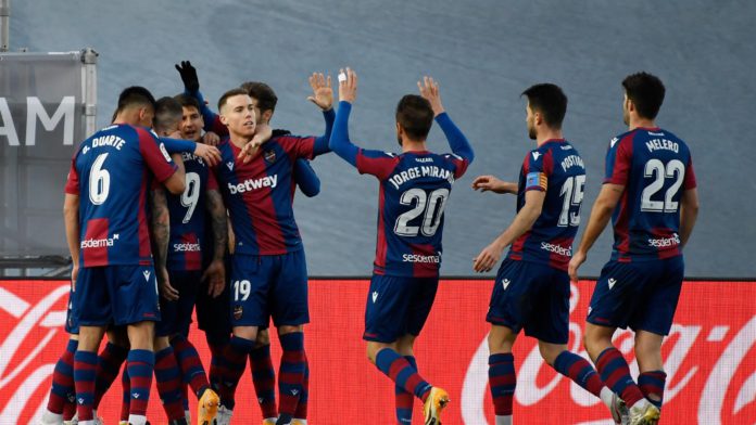 Levante's Spanish forward Roger Marti (2L) is congratulated after scoring his team's second goal during the Spanish league football match Real Madrid CF against Levante UD at the Alfredo di Stefano stadium in Valdebebas, on the outskirts of Madrid on Janu Image credit: Getty Images