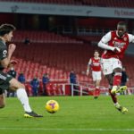 Manchester United's English defender Harry Maguire (L) blocks a shot from Arsenal's French-born Ivorian midfielder Nicolas Pepe during the English Premier League football match between Arsenal and Manchester United at the Emirates Stadium in London on Jan Image credit: Getty Images