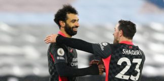 Mohamed Salah of Liverpool celebrates scoring his side's second goal with team mate Xherdan Shaqiri during the Premier League match between West Ham United and Liverpool at London Stadium Image credit: Getty Images