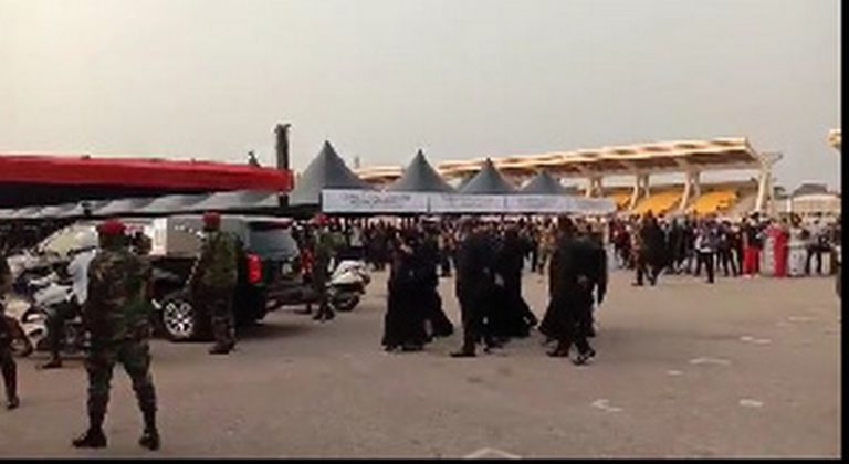 The children of the late president in shot