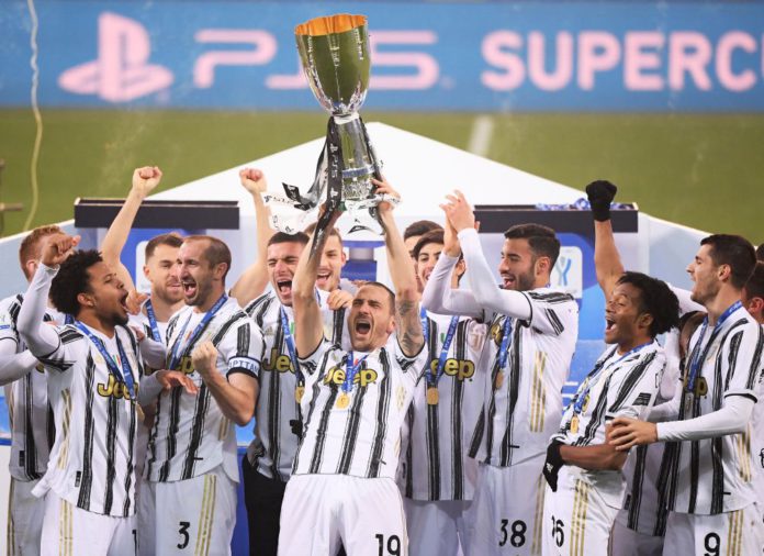 Italian Super Cup - Final - Juventus v Napoli - Mapei Stadium, Reggio Emilia, Italy - January 20, 2021 Juventus players celebrate with the Italian Super Cup REUTERS/Alberto Lingria