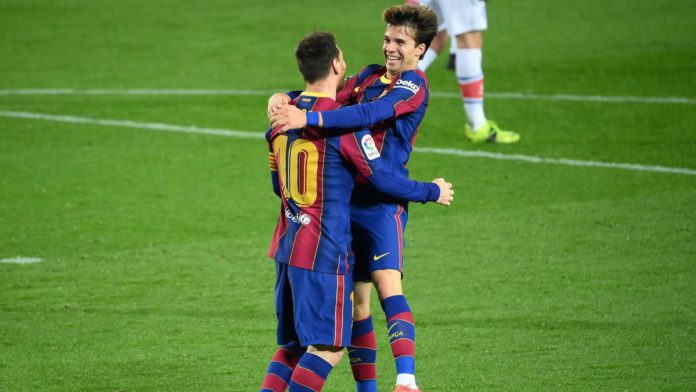 Barcelona's Argentinian forward Lionel Messi celebrates with Barcelona's Spanish midfielder Riqui Puig Image credit: Getty Images