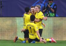 Erling Haaland (R) of Borussia Dortmund celebrates with Marco Reus and team mates after scoring their side's third goal during the UEFA Champions League Round of 16 match between Sevilla FC and Borussia Dortmund at Estadio Ramon Sanchez Pizjuan on Februa Image credit: Getty Images
