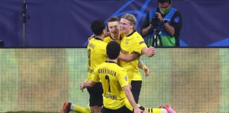 Erling Haaland (R) of Borussia Dortmund celebrates with Marco Reus and team mates after scoring their side's third goal during the UEFA Champions League Round of 16 match between Sevilla FC and Borussia Dortmund at Estadio Ramon Sanchez Pizjuan on Februa Image credit: Getty Images