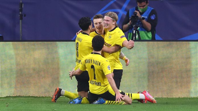 Erling Haaland (R) of Borussia Dortmund celebrates with Marco Reus and team mates after scoring their side's third goal during the UEFA Champions League Round of 16 match between Sevilla FC and Borussia Dortmund at Estadio Ramon Sanchez Pizjuan on Februa Image credit: Getty Images