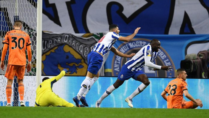 Moussa Marega of FC Porto celebrates with Mehdi Taremi after scoring his team's second goal during the UEFA Champions League Round of 16 match between FC Porto and Juventus at Estadio do Dragao on February 17, 2021 in Porto, Image credit: Getty Images