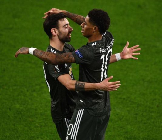 Marcus Rashford of Manchester United (R) celebrates a goal with teammate Bruno Fernandes Image credit: Getty Images