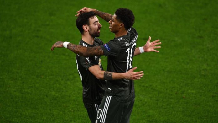 Marcus Rashford of Manchester United (R) celebrates a goal with teammate Bruno Fernandes Image credit: Getty Images