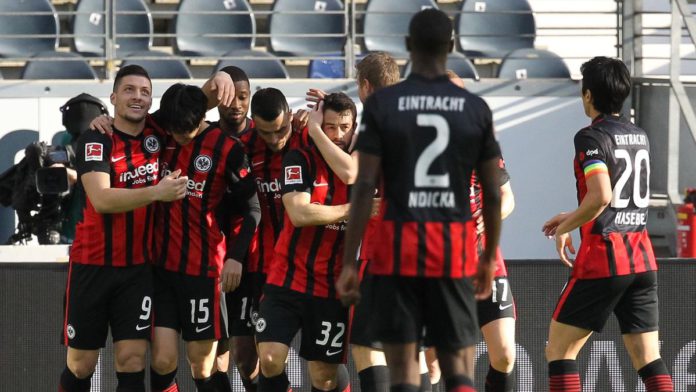 Frankfurt's Japanese midfielder Daichi Kamada (2nd L) celebrates with Frankfurt's Serbian forward Luka Jovic (L) and other teammates after scoring the 1-0 during the German first division Bundesliga football match Eintracht Frankfurt vs FC Bayern Munich i Image credit: Getty Images