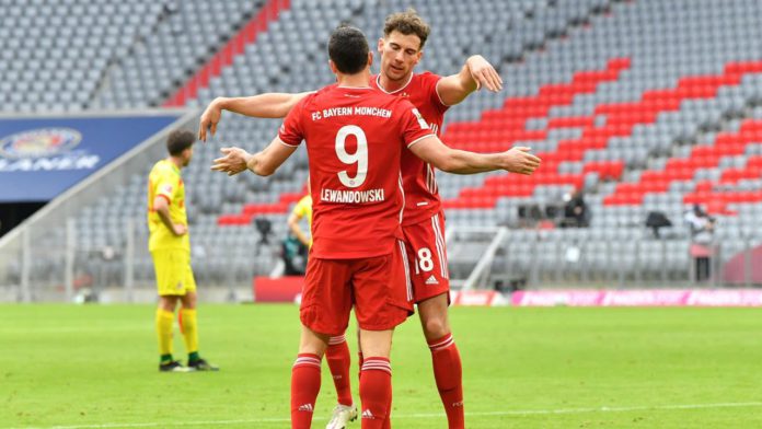 Bayern Munich's Polish forward Robert Lewandowski (L) and Bayern Munich's German midfielder Leon Goretzka Image credit: Getty Images