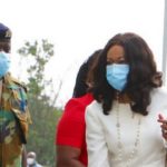 Jean Mensa is being protected by a military officer