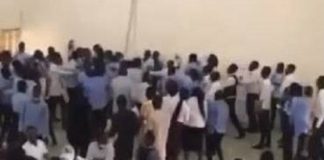 Embattled lecturer surrounded by angry students