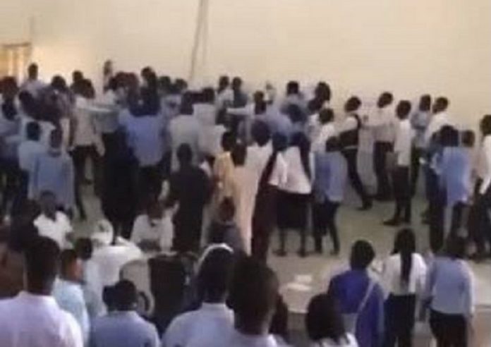 Embattled lecturer surrounded by angry students