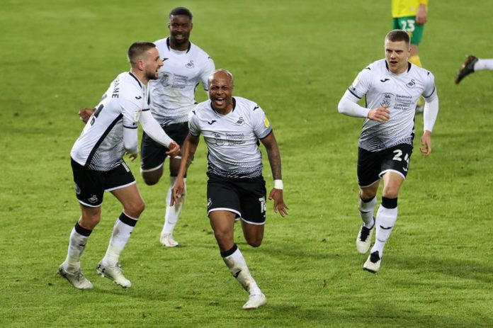 Andre Ayew celebrates with Swansea City teammates