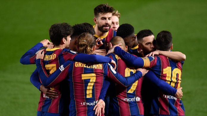 Barcelona players celebrate their third goal scored by Barcelona's Danish forward Martin Braithwaite during Spanish Copa del Rey (King's Cup) semi-final second leg football match between FC Barcelona and Sevilla FC at the Camp Nou stadium in Barcelona Image credit: Getty Images