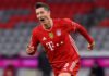 Robert Lewandowski of FC Bayern Muenchen celebrates after scoring their team's fourth goal, completing his hat-trick, during the Bundesliga match between FC Bayern Muenchen and Borussia Dortmund at Allianz Arena on March 06, 2021 in Munich, Germany. Image credit: Getty Images