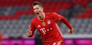 Robert Lewandowski of FC Bayern Muenchen celebrates after scoring their team's fourth goal, completing his hat-trick, during the Bundesliga match between FC Bayern Muenchen and Borussia Dortmund at Allianz Arena on March 06, 2021 in Munich, Germany. Image credit: Getty Images