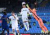 Rodrigo of Leeds United headers the ball, as Illan Meslier of Leeds United looks to punch Image credit: Getty Images