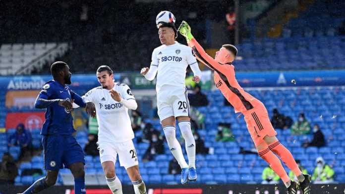 Rodrigo of Leeds United headers the ball, as Illan Meslier of Leeds United looks to punch Image credit: Getty Images