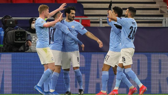 Ilkay Gundogan of Manchester City celebrates with team mates Phil Foden, Kevin De Bruyne, Joao Cancelo and Riyad Mahrez after scoring their side's second goal during the UEFA Champions League Round of 16 match between Manchester City and Borussia Moenchen Image credit: Getty Images