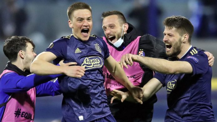 Dinamo Zagreb's players celebrate their 3-0 victory at the end of the UEFA Europa League round of 16 Image credit: Getty Images