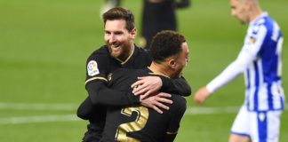 Barcelona's Barcelona's US defender Sergino Dest celebrates with Barcelona's Argentinian forward Lionel Messi (back) after scoring a goal during the Spanish League football match between Real Sociedad and Barcelona Image credit: Getty Images