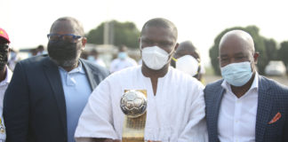 Sports Minister with U-20 Afcon trophy