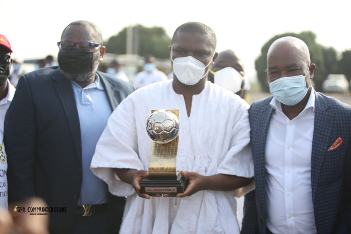 Sports Minister with U-20 Afcon trophy