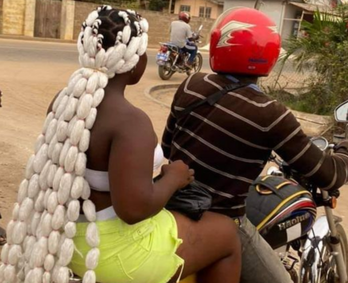 Lady’s hairstyle looking like packets of ‘gari’ causes stir on social media