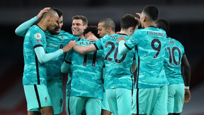 Mohamed Salah of Liverpool celebrates with Fabinho, Ozan Kabak, James Milner, Thiago Alcantara and teammates after scoring their team's second goal during the Premier League match between Arsenal and Liverpool at Emirates Stadium on April 03, 2021 in London Image credit: Getty Images