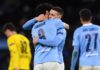 Manchester City's English midfielder Phil Foden (2R) celebrates scoring his team's second goal with Manchester City's German midfielder Ilkay Gundogan during the UEFA Champions League first leg quarter-final football match between Manchester City and Borussia Dortmund. Image credit: Getty Images