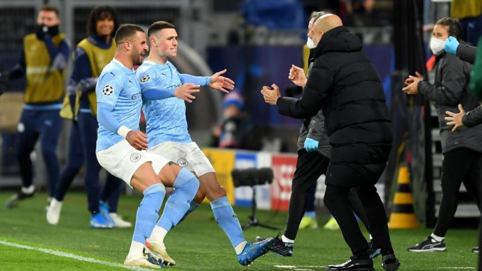 Phil Foden esulta abbracciando Pep Guardiola, Borussia Dortmund-Manchester City, Getty Images Image credit: Getty Images