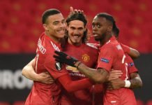Manchester United's Uruguayan striker Edinson Cavani (C) celebrates with teammates after scoring the opening goal of the UEFA Europa league quarter final, second leg football match between Manchester United and Granada at Old Trafford Image credit: Getty Images