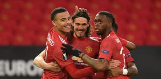 Manchester United's Uruguayan striker Edinson Cavani (C) celebrates with teammates after scoring the opening goal of the UEFA Europa league quarter final, second leg football match between Manchester United and Granada at Old Trafford Image credit: Getty Images