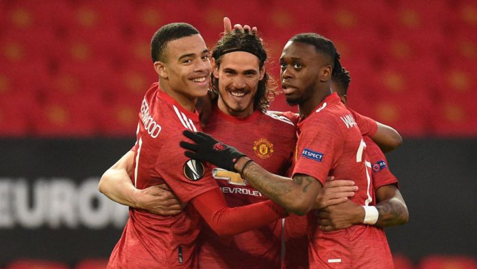 Manchester United's Uruguayan striker Edinson Cavani (C) celebrates with teammates after scoring the opening goal of the UEFA Europa league quarter final, second leg football match between Manchester United and Granada at Old Trafford Image credit: Getty Images