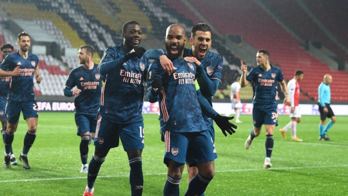 Alex Lacazette celebrates scoring the 2nd Arsenal goal with (L) Nicolas Pepe and (R) Dani Ceballos during the UEFA Europa League Quarter Final Second Leg match between Slavia Praha and Arsenal at Sinobo Stadium Image credit: Getty Images