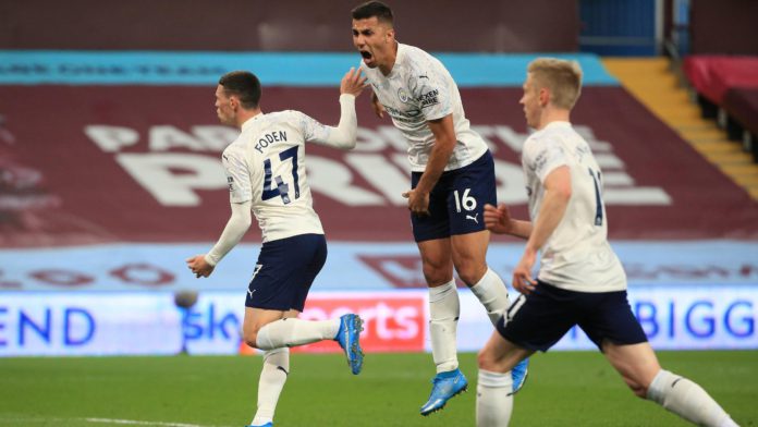 Phil Foden of Manchester City celebrates with Rodrigo after scoring their side's first goal during the Premier League match between Aston Villa and Manchester City at Villa Park on April 21, 2021 in Birmingham, England. Image credit: Getty Images