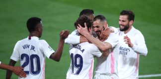 Alvaro Odriozola of Real Madrid celebrates with Karim Benzema after scoring their side's second goal during the La Liga Santander match between Cadiz CF and Real Madrid at Estadio Ramon de Carranza on April 21, 2021 in Cadiz, Spain Image credit: Getty Images