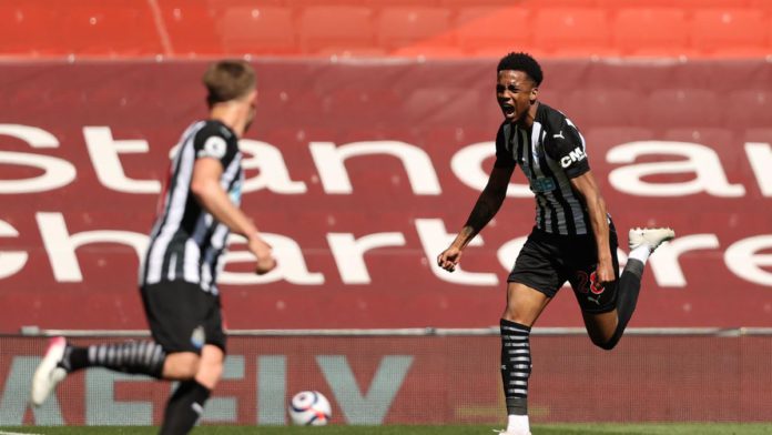 Joe Willock of Newcastle United celebrates after scoring their side's first goal during the Premier League match between Liverpool and Newcastle United at Anfield Image credit: Getty Images