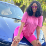 Sandra Ankobiah shows off blue Porsche 911 Carrera