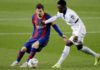 Getafe's Ghanaian midfielder Sabit Abdulai (right) tries to tackle Barcelona's Lionel Messi