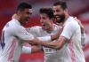 Nacho of Real Madrid celebrates with team mates (L - R) Casemiro and Alvaro Odriozola after scoring their side's first goal during the La Liga Santander match between Athletic Club and Real Madrid Image credit: Getty Images