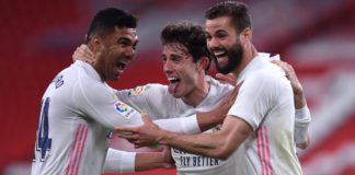 Nacho of Real Madrid celebrates with team mates (L - R) Casemiro and Alvaro Odriozola after scoring their side's first goal during the La Liga Santander match between Athletic Club and Real Madrid Image credit: Getty Images