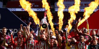 Pontus Jansson of Brentford lifts the Sky Bet Championship Play Off Trophy following victory in the Sky Bet Championship Play-off Final between Brentford FC and Swansea City at Wembley Stadium on May 29, 2021 in London, England. Image credit: Getty Images