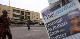 A man looks at newspapers at a newsstand in Abuja, Nigeria June 5, 2021 REUTERS - AFOLABI SOTUNDE